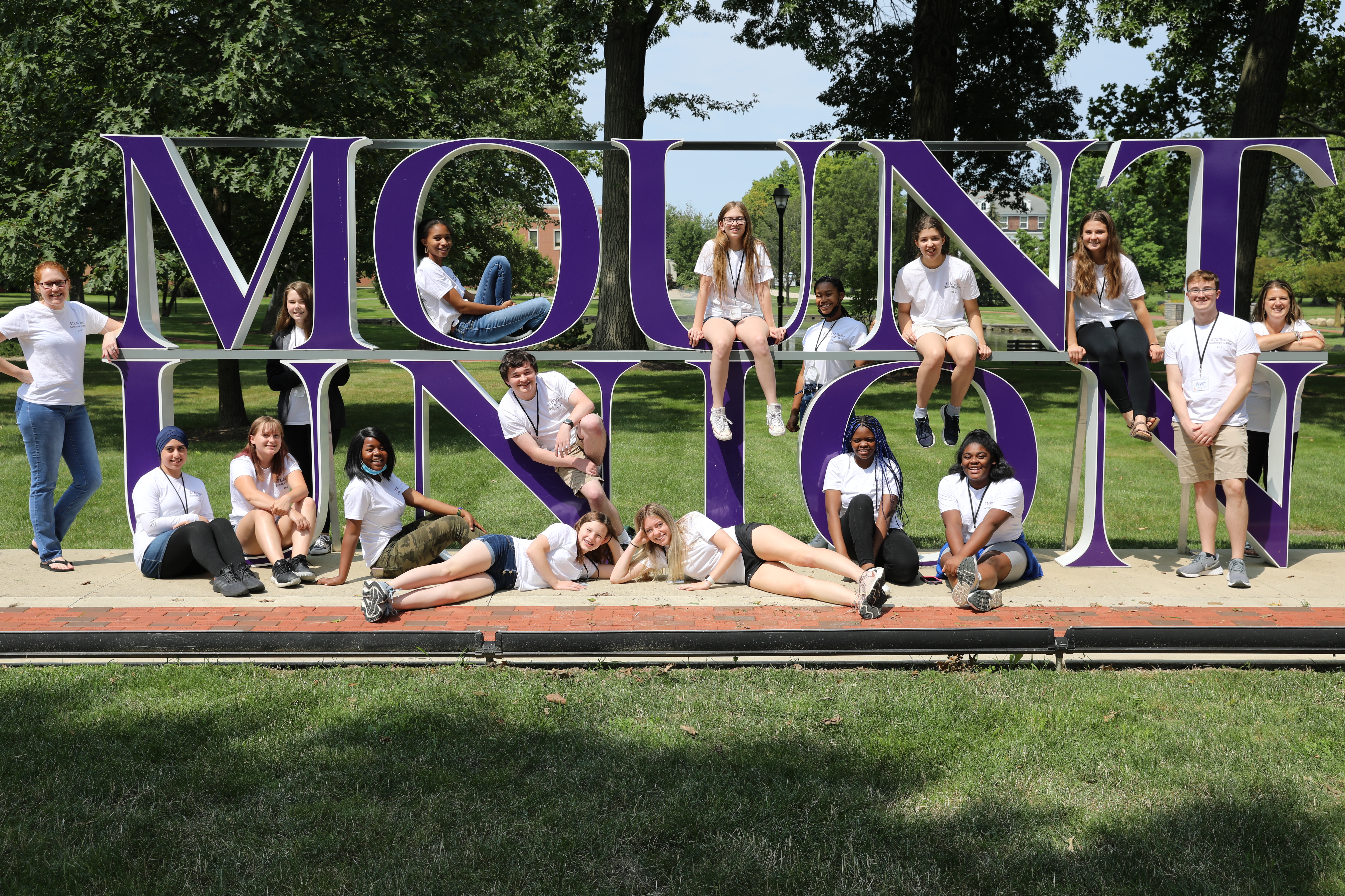 STEMcoding camp participants and staff pose in front of the Mount Union sign
