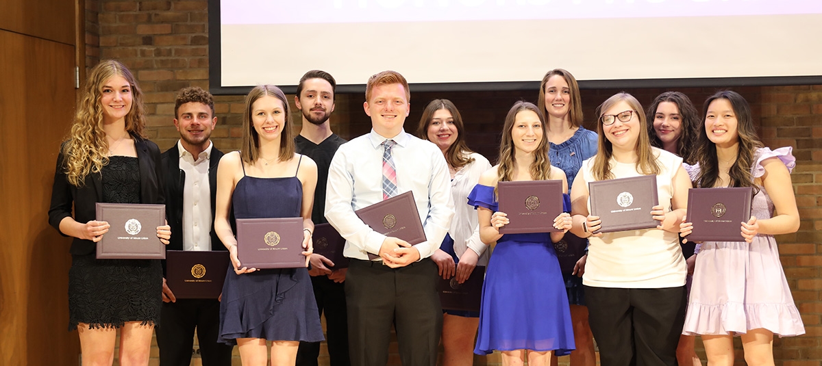 group of honors students receiving certificates