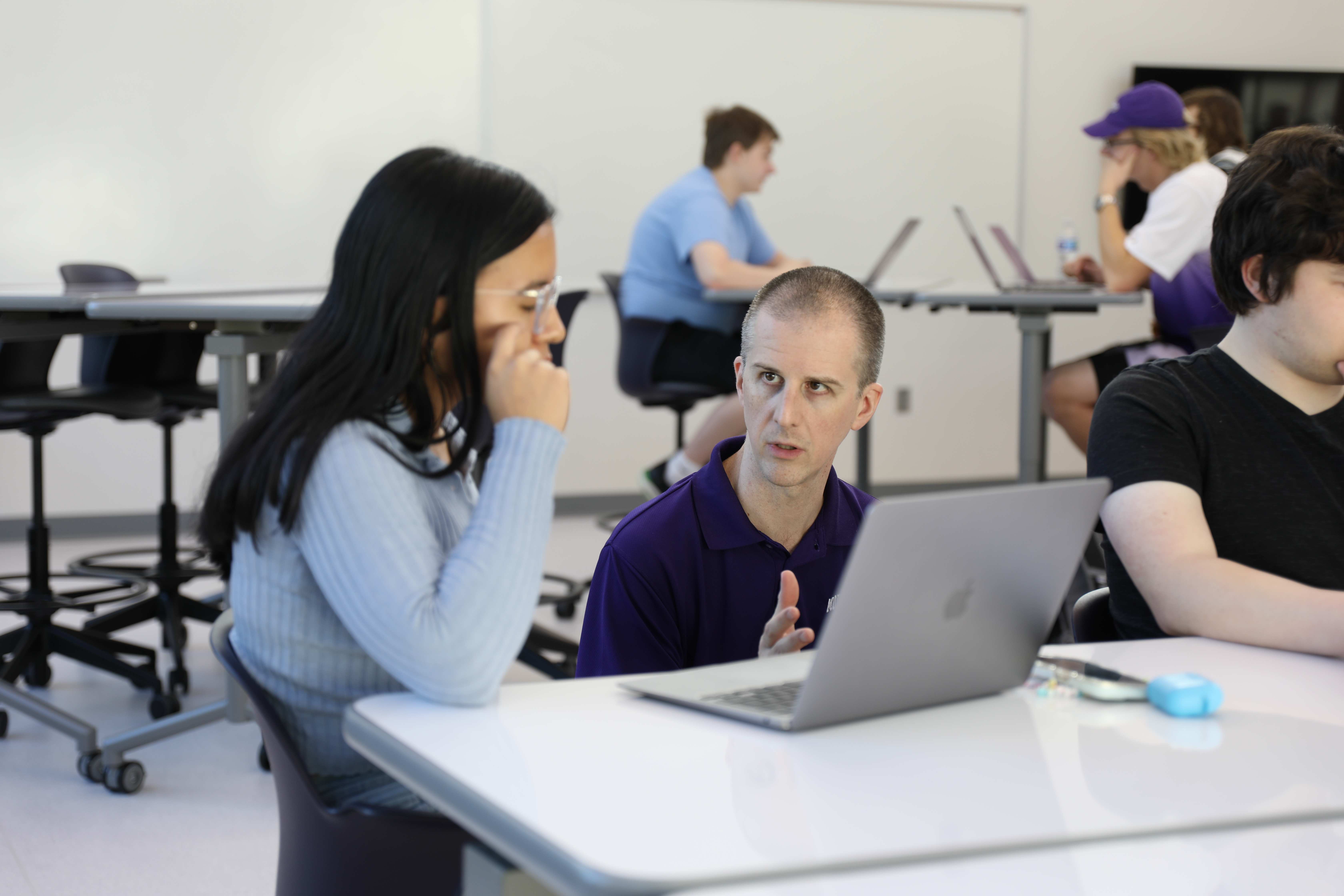 campbell speaking with a student on a computer