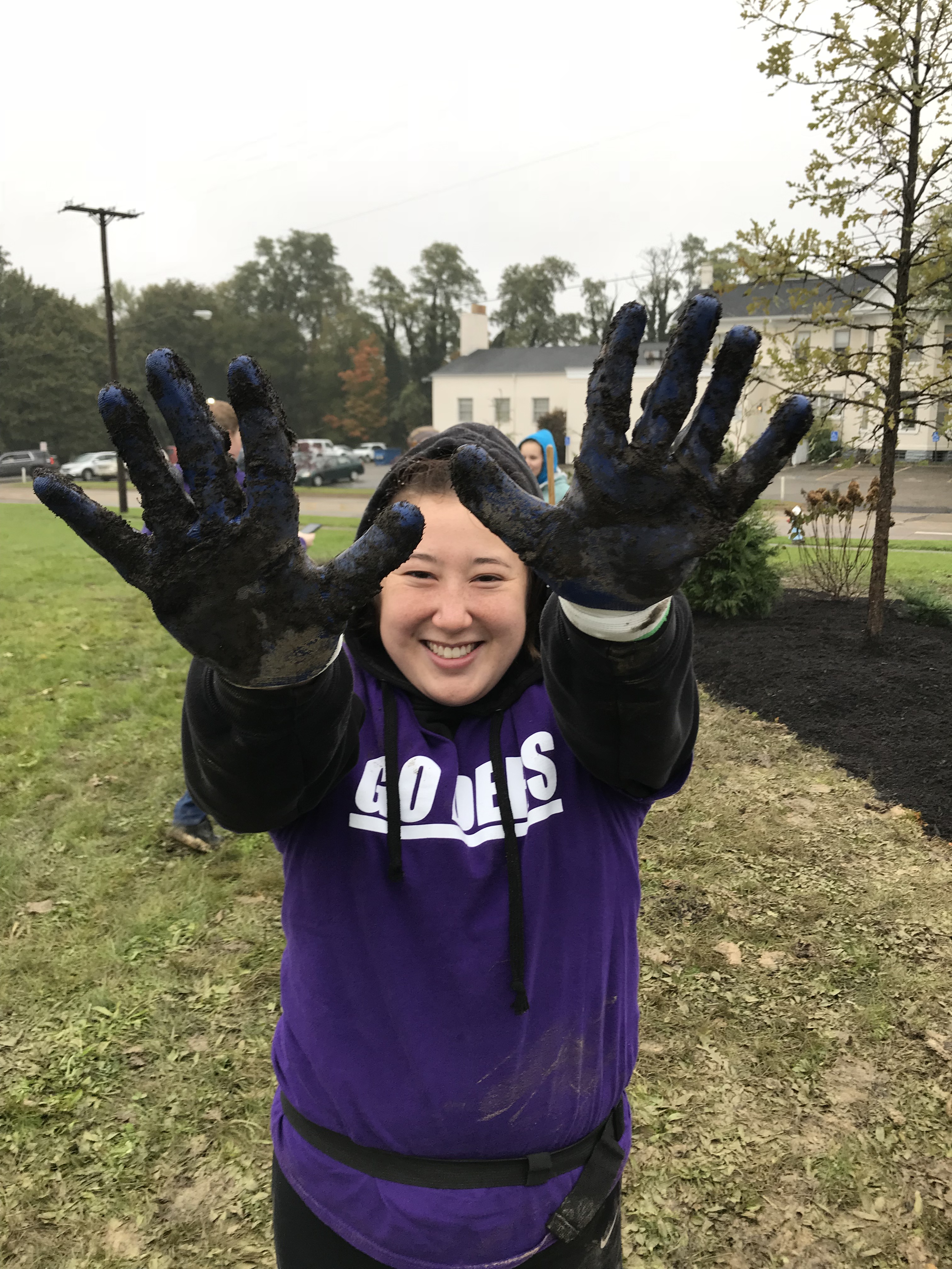 Student showing her hands to camera