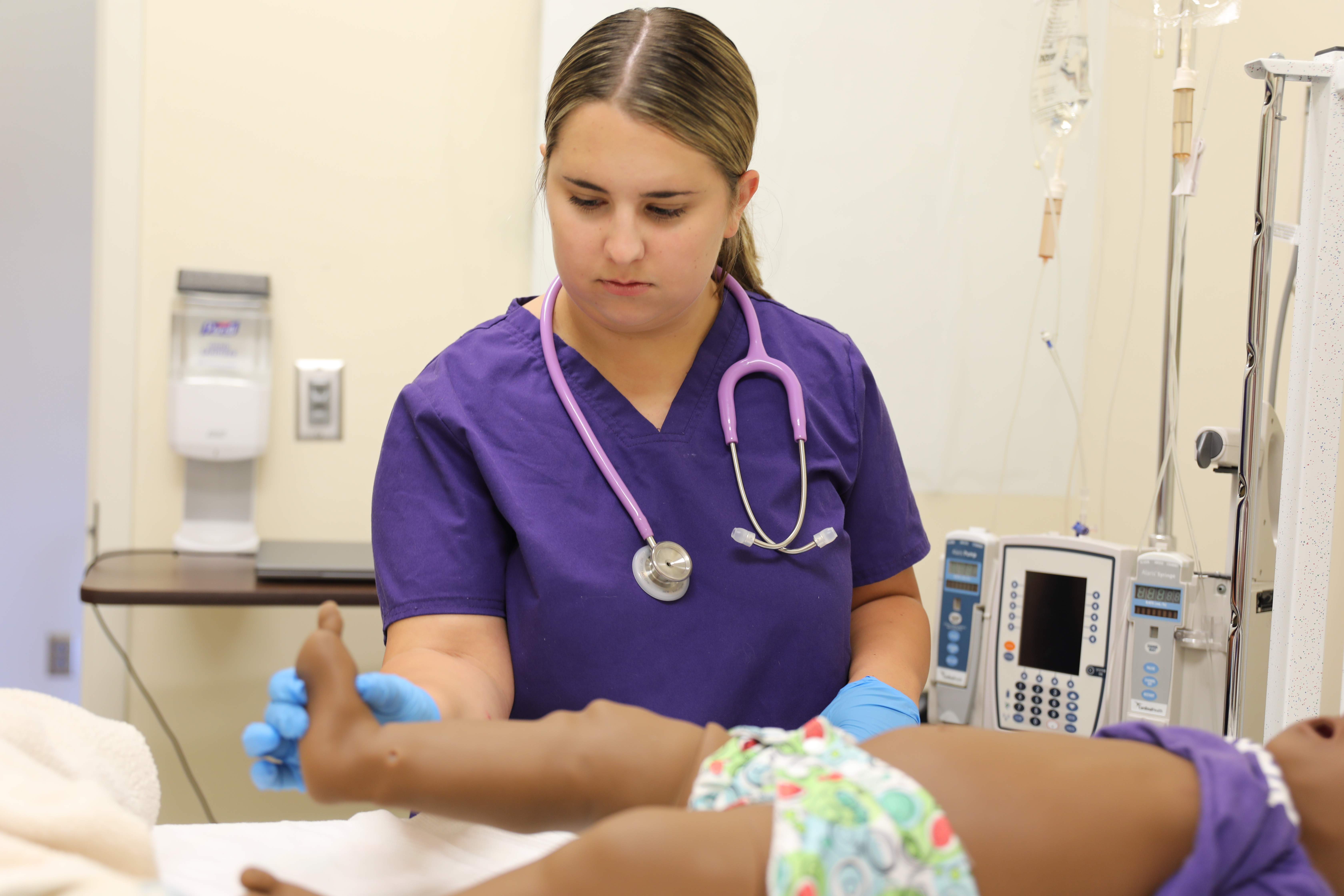 Hooper tending to a baby's needs during a lab