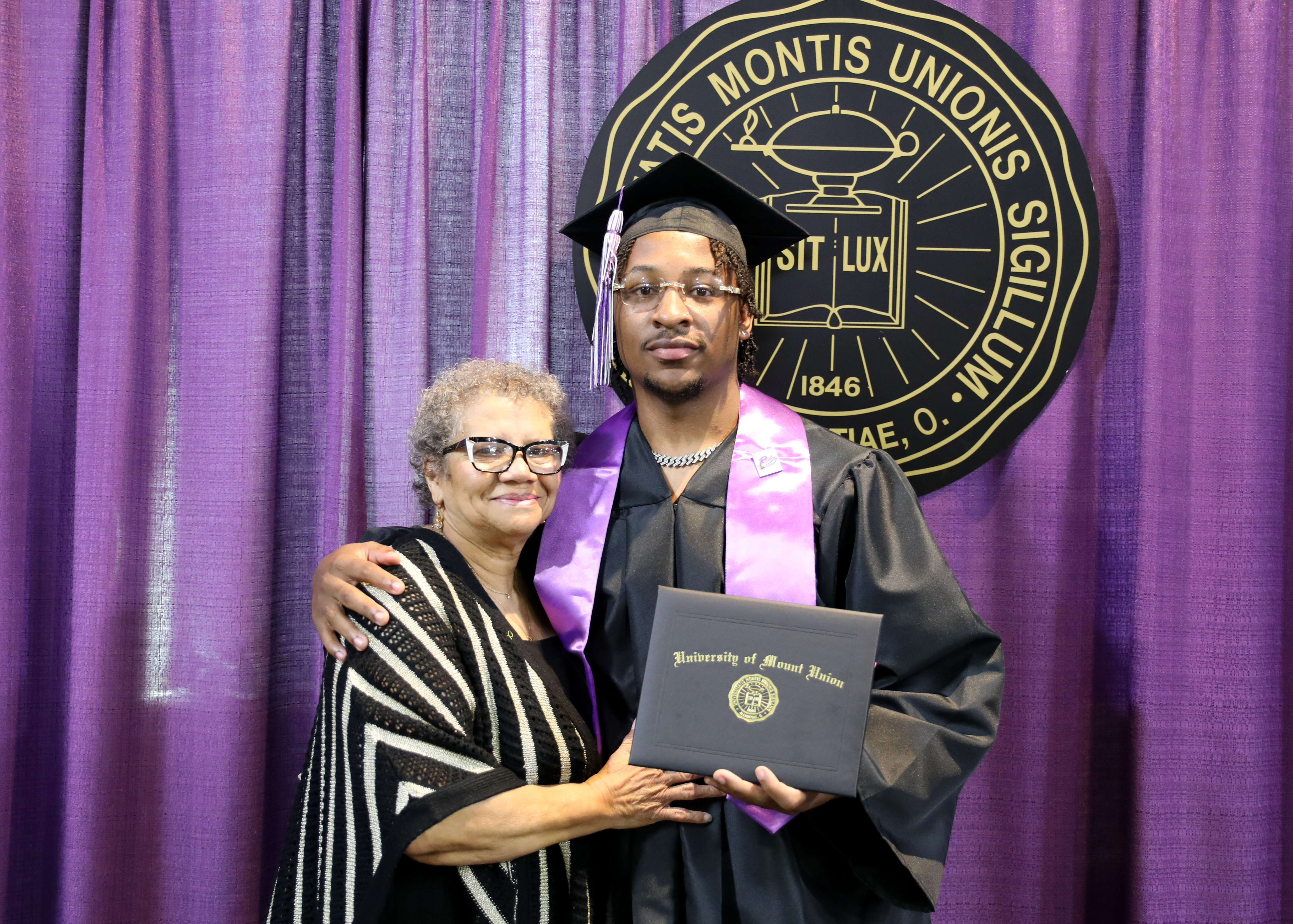 Student and family at Mount Union 2023 Commencement ceremony.