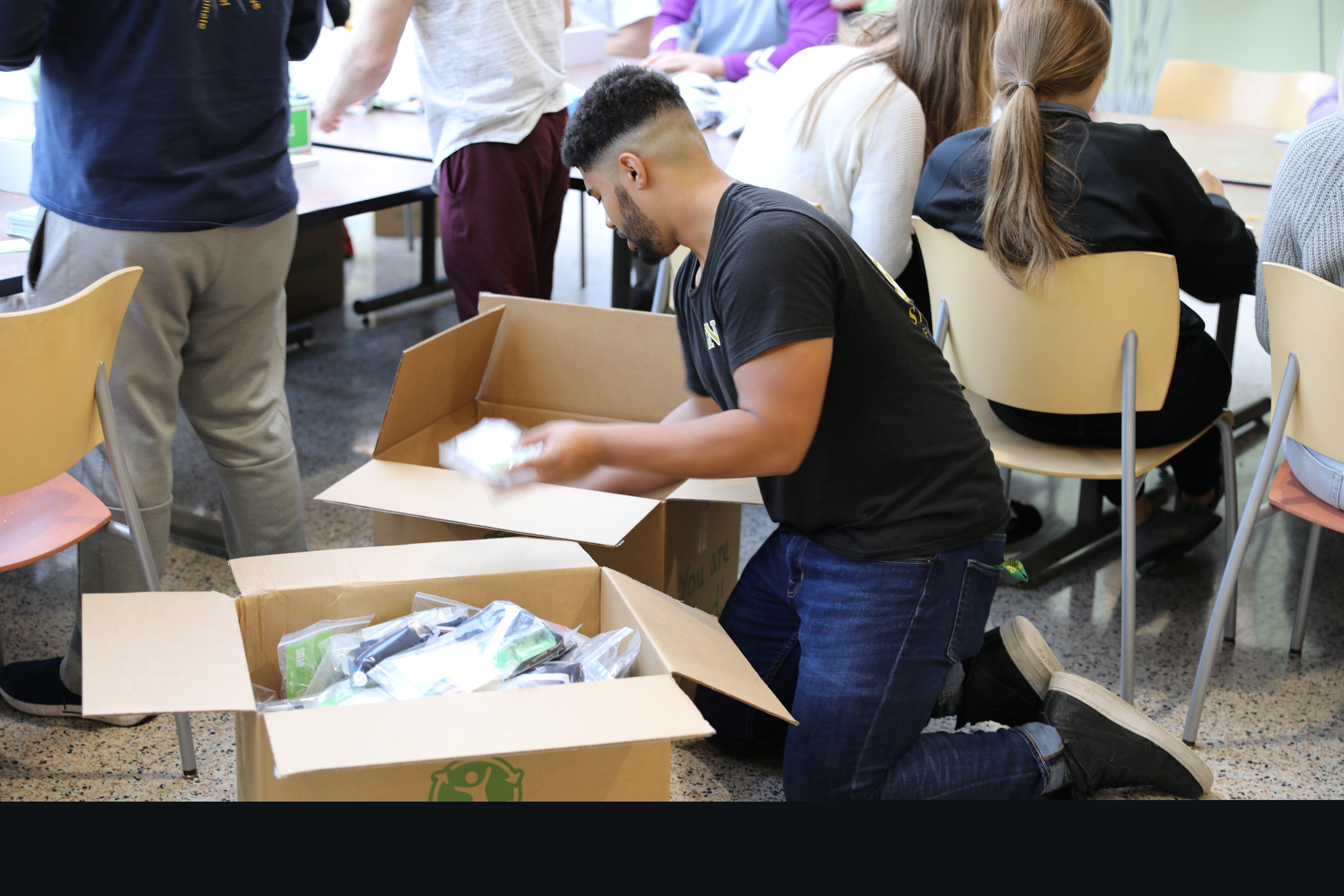 Student packing hygiene kits