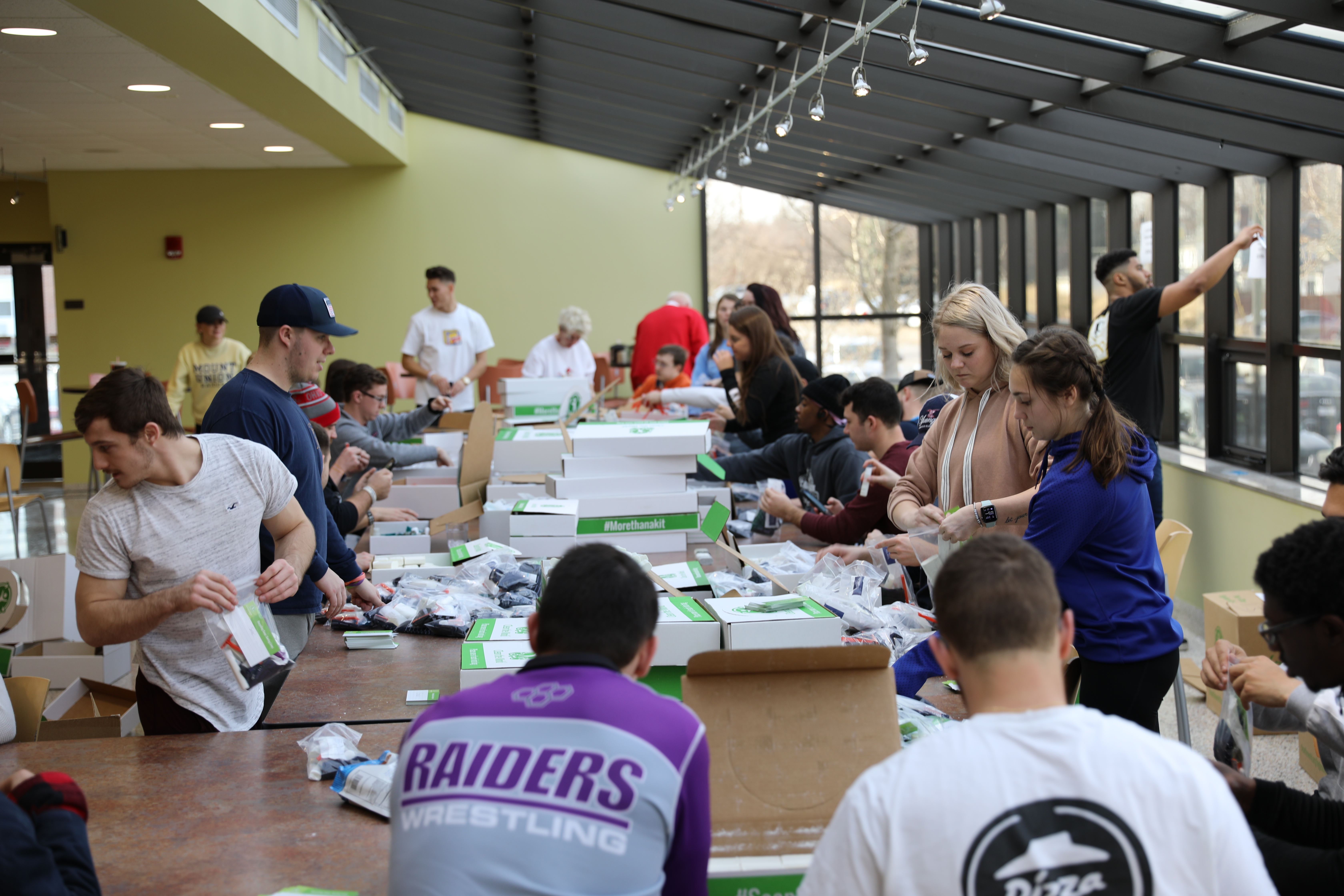 Students packing hygiene kits