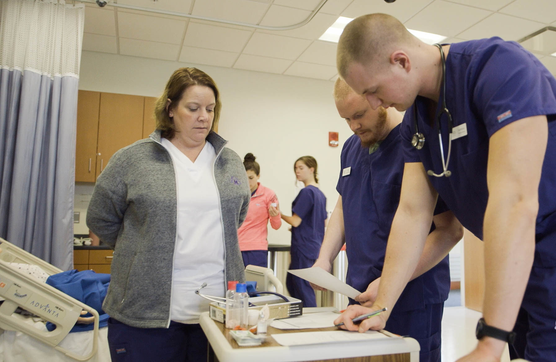 Nursing students working in lab