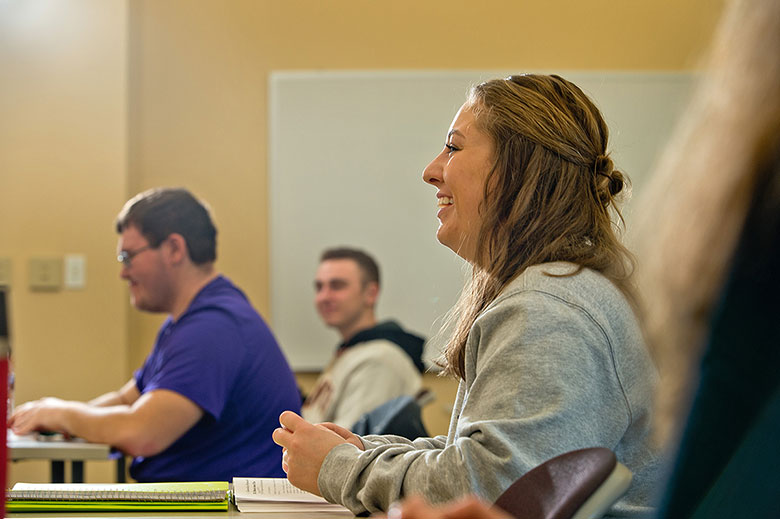 student smiling in class